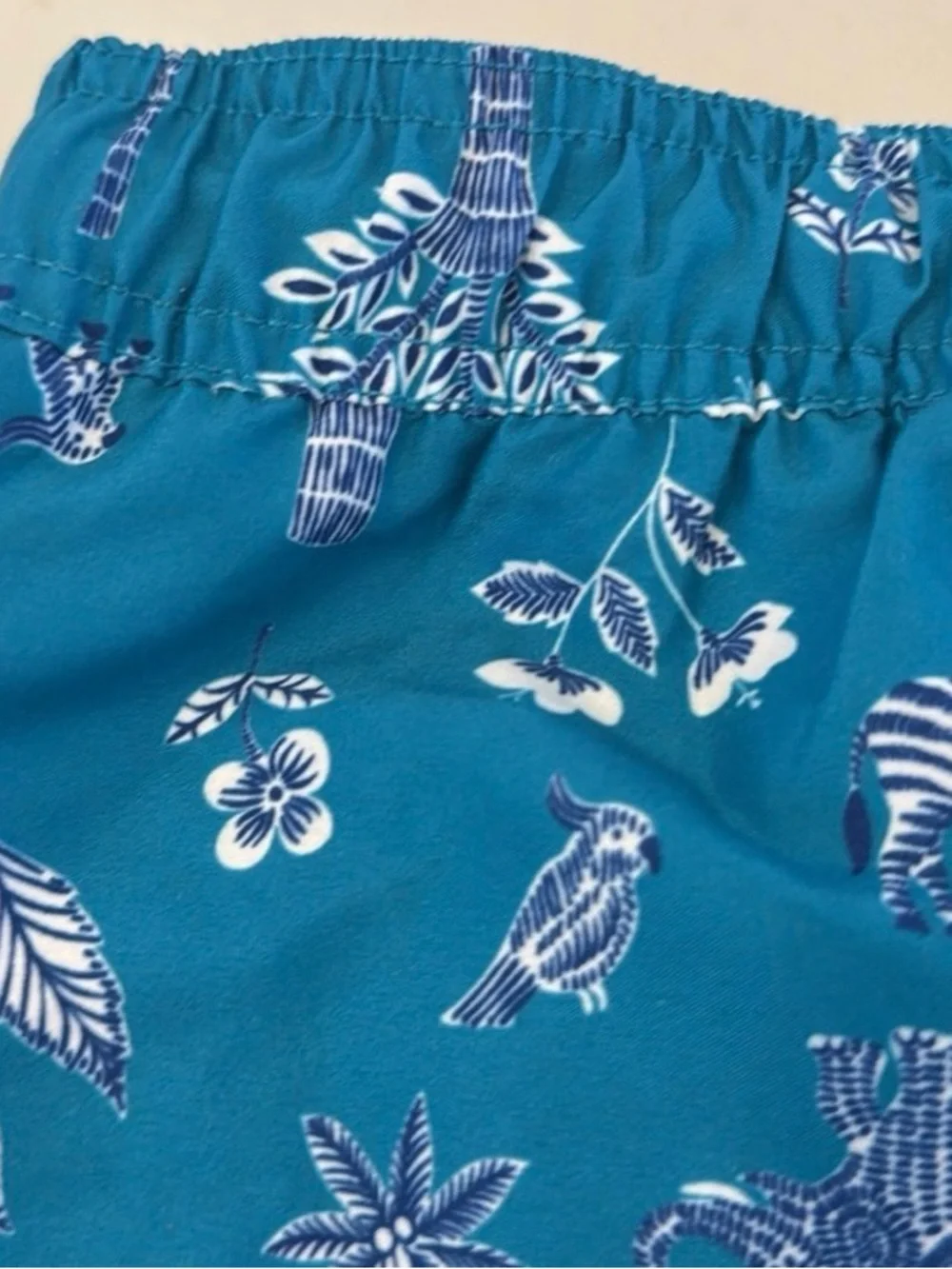 Janie and Jack Teal World Love Swim Trunks with Animal Print